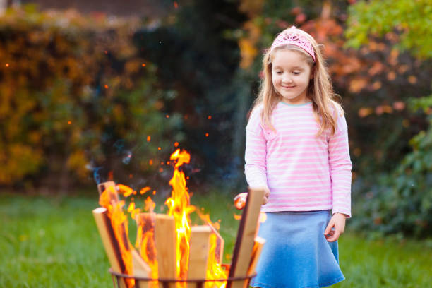 istock Child with smores at fire. Kids roast marshmallow. 1681202707