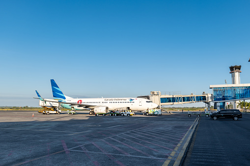 Lombok, Indonesia - 09.03.2023: Garuda Indonesia aircraft at Lombok International Airport. Garuda Indonesia is the flag carrier of Indonesia