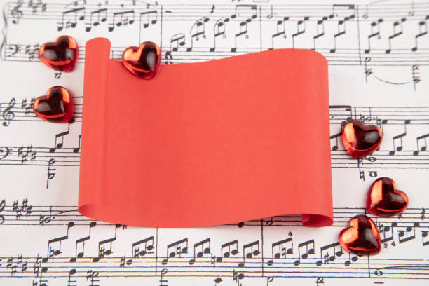 Colourful paper butterflies, a musical treble cleff and a handrawn pink heart.