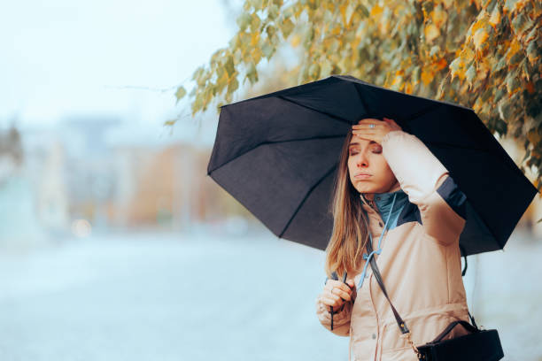 Forgetful Woman Remembering Something Important on a Rainy day