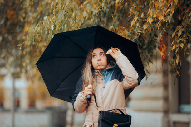istock Woman using Eye Drops During Autumnal Rainy Day 1681361195