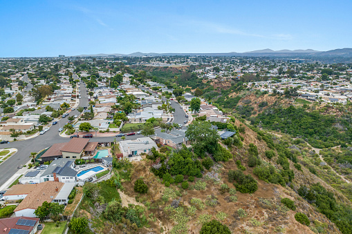 Aerial view of house in Serra Mesa City in San Diego, California, USA. Green Dry Valley and Villas