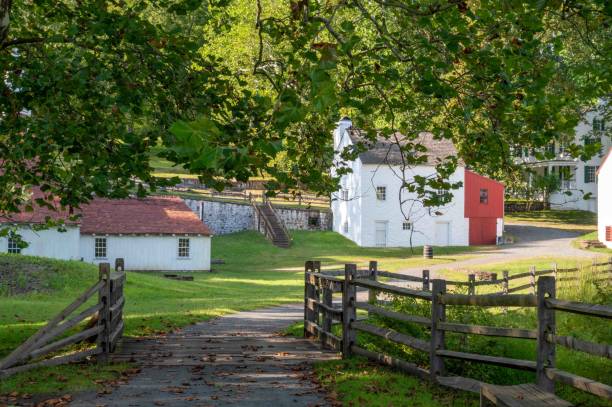 istock View down rustic lane to colonial American village 1681377939