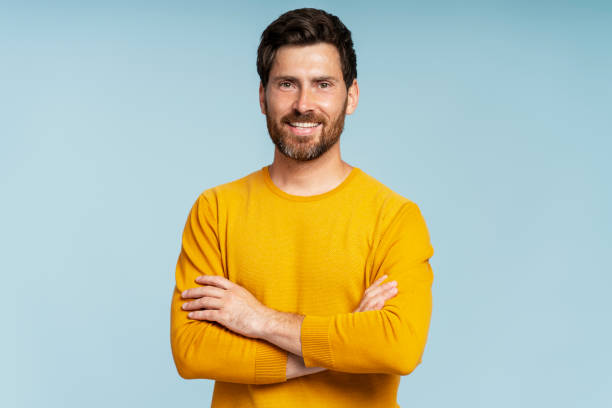 istock Handsome smiling bearded man wearing t shirt looking at camera isolated 1681429219