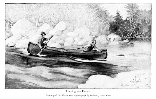 Two men paddle a canoe through the rapids in a river. Illustration engraving published 1874. This edition is in my private collection. Copyright is in public domain.
