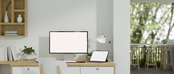 istock A modern minimalist white home workplace with a computer and a digital tablet mockup on a table. 1681587063