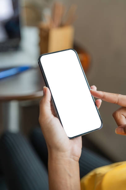 istock Close up image of female hands using smartphone with blank white screen in the home 1681632154