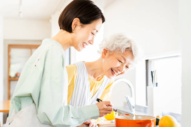 istock Two Asian women are cooking in the kitchen. 1681641849