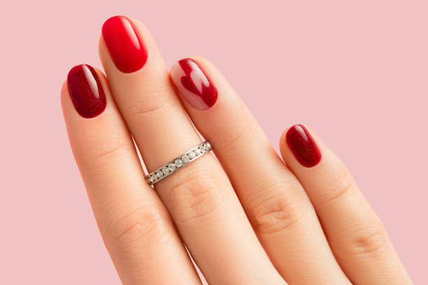 istock Female hand with manicure on pink background 1681654516