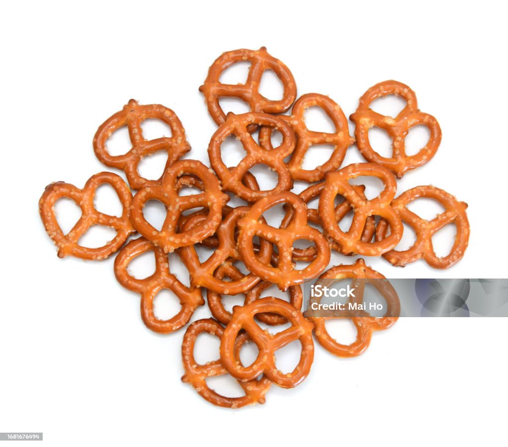 Křupavé preclíky na bílém pozadí - Bez autorských poplatků Barevný obrázek Stock fotka Křupavé preclíky na bílém pozadí - Bez autorských poplatků Barevný obrázek Stock fotka