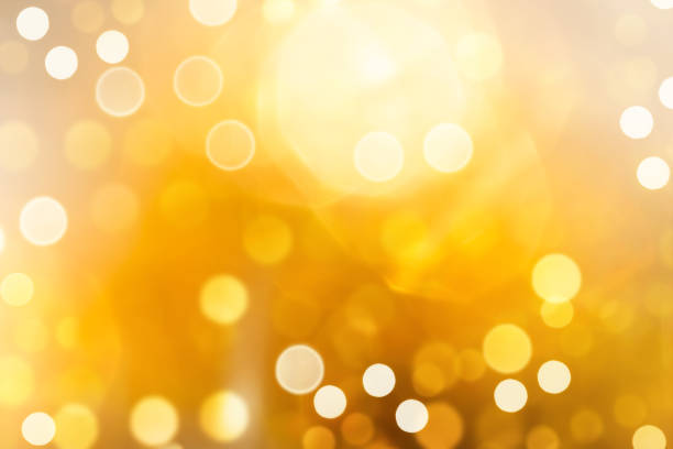 istock Bright yellow defocused light background for Christmas. Lens flare from bright light. 1681717469