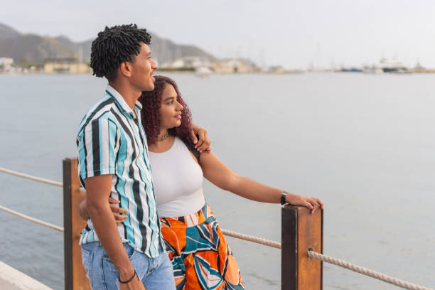 istock tourists enjoying the sunset in a quiet bay. 1681729575