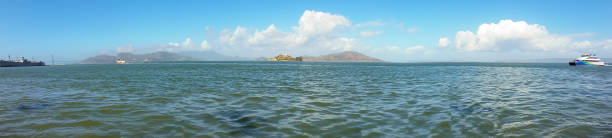 San Francisco Bay View of the San Francisco Bay. Alcatraz and the Golden Gate Bridge can be seen in the background. san francisco bay stock pictures, royalty-free photos & images