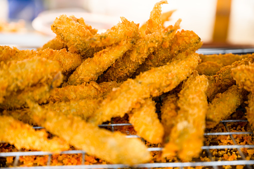Fried capelin fish in batter, Thailand.