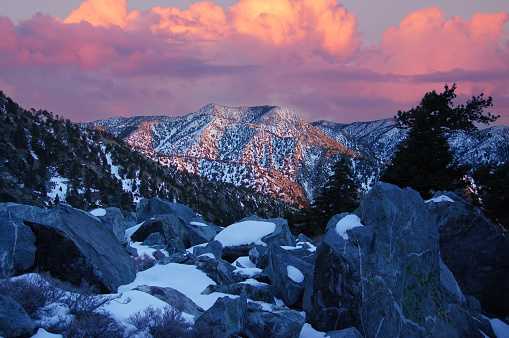 Vibrant Sunset Skies over San Gabriel Mountains via Mt San Antonio summit, A.K.A. Mount Baldy or Old Baldy. Los Angeles and San Bernardino Counties, California, USA.