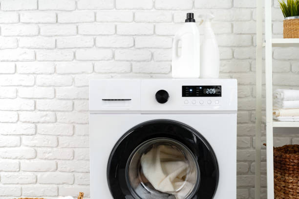 istock Detergent bottle on washing machine in a laundry room 1681828293