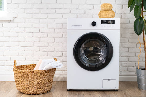 istock Washing machine and basket in a laundry room 1681845212