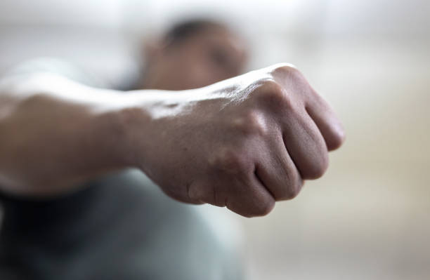 The angry man clenched his fist. The angry man clenched his fist. Concept of violence. fist stock pictures, royalty-free photos & images