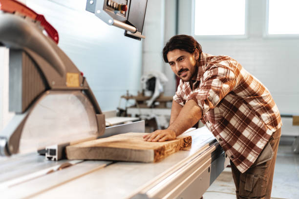 istock Male carpenter using some woodworking tools for his work in a factory 1681865837