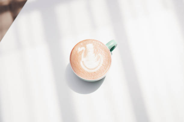 istock Coffee latte on white table, latte art at the coffee shop 1681896934
