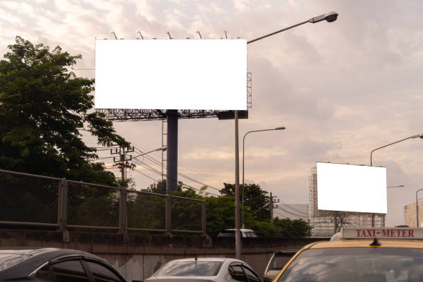 istock Blank billboard on one of Thailand's streets, a blank billboard with copy space for text or content, mockup of a blank billboard in a big city 1681910657
