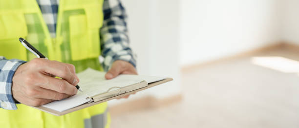 istock inspector or engineer is inspecting construction and quality assurance new house using a checklist. Engineers or architects or contactor work to build the house before handing it over to the homeowner 1681919600