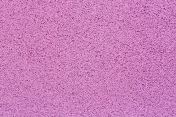istock Sample texture pink plaster. The wall is finished with decorative cement stucco. An example of a decorative wall with pink cement. Pink concrete texture of walls for the background and wallpaper. 1681966636