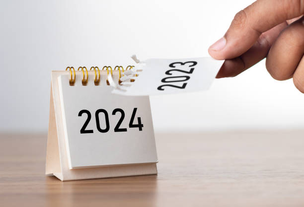 istock 2024 Happy New year background. Turns over a calendar sheet. Setup objective target business cost and budget planning of new year concept. year change from 2023 to 2024. 1681973215
