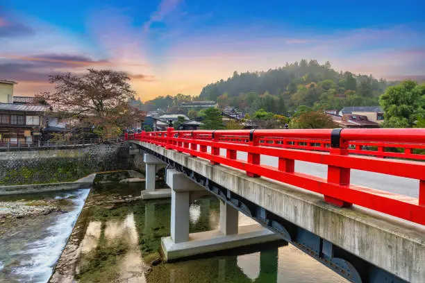Takayama Gifu Japan, sunrise city skyline at Nakabashi red bridge and Miyagawa river in autumn season