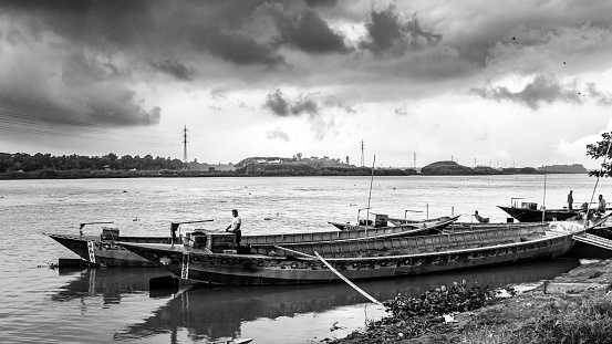 Traditional boat station under the dark cloudy sky on September 05, 2022, from Ruhitpur, Bangladesh
