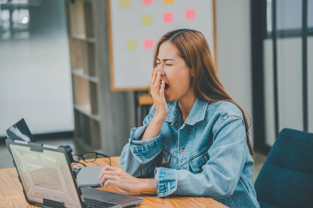 istock Female programmers are sleepy and exhausted after working and planning to work on programming, software coding and web design. Concept technology development. 1682011423