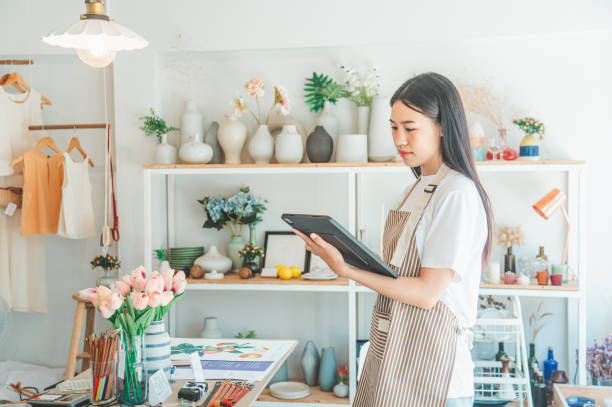 istock Small business owners are preparing a small shop and checking through a tablet and checking orders. 1682013064