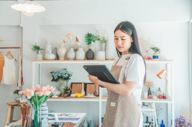 istock Small business owners are preparing a small shop and checking through a tablet and checking orders. 1682016940