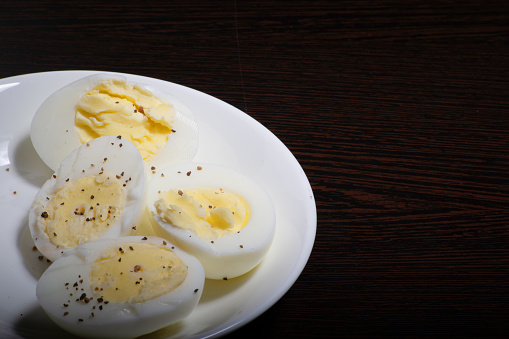 Slice boiled eggs in plate, natural protein foods