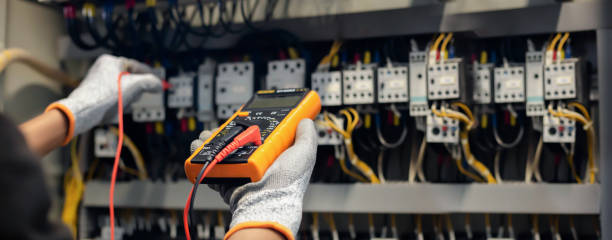 istock Electrician engineer uses a multimeter to test the electrical installation and power line current in an electrical system control cabinet. 1682026406
