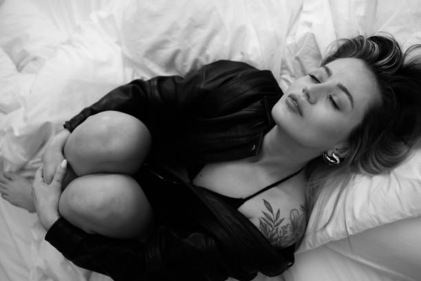 istock Young Blonde Woman in Bed 1682038463