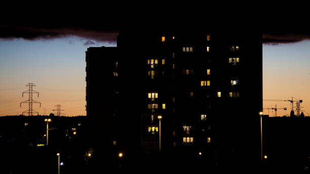 istock Time lapse residential block at night with moving clouds background 1682040135