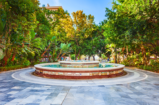 Marbella, Spain - October 24, 2021: Fuente Virgen del Rocio fountain in the Alameda public park in Marbella city in the province of Malaga in the Andalusia, Spain