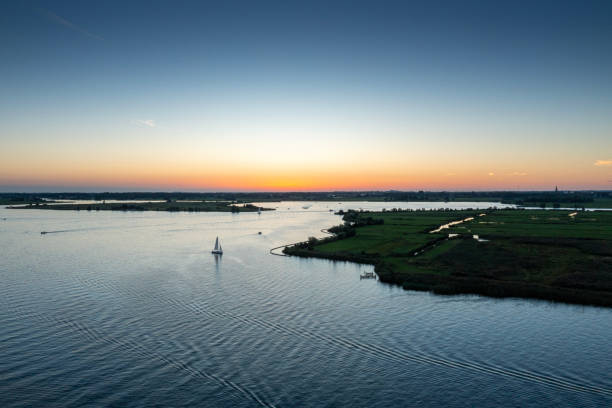 istock Sunset over a lake in the Netherlands 1682045737