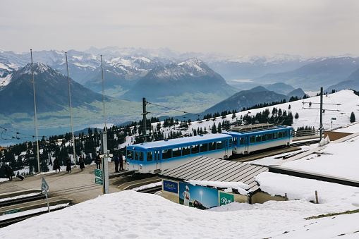 Red overhead cable car cabin in the mountains