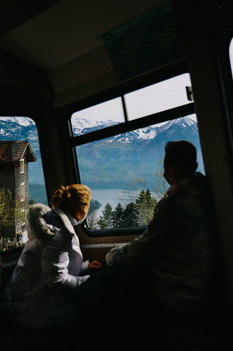 Schwyz, Switzerland - April 12, 2022: Cogwheel train window view of railway track Rigi Kulm line, Switzerland.