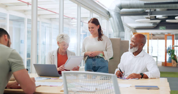 istock Diversity, meeting or digital agency people with documents for collaboration, marketing KPI planning or strategy review in office. Startup or teamwork for SEO feedback, consulting or research idea 1682085446