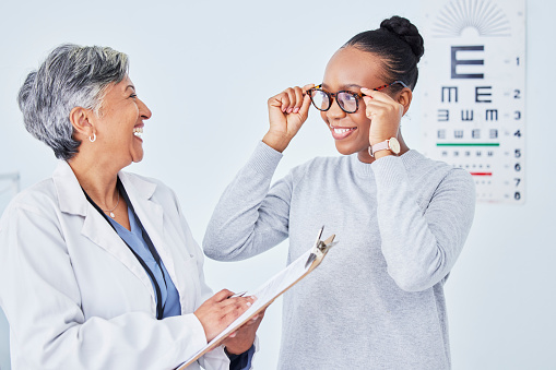 Vision, glasses and optometrist, clipboard and black woman patient, health insurance and prescription lens with frame. Eye care, exam and diagnosis with assessment, paperwork and choice with help