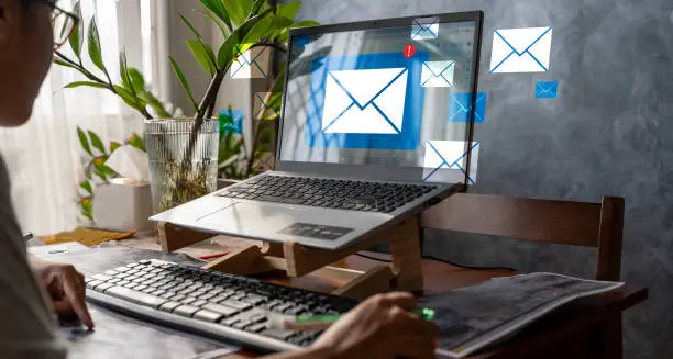 Photo of Email marketing concept, person reading email on laptop, receiving new messages Email inbox.