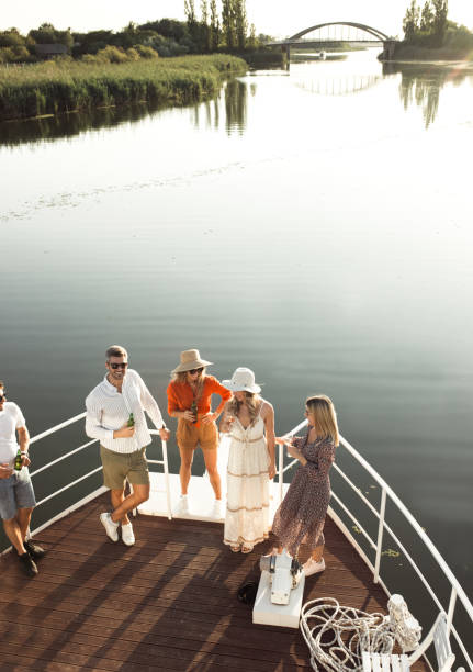 istock group of friends having fun on a boat at sunset 1682145328