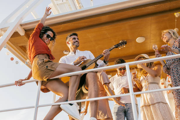 istock group of friends having fun on a boat at sunset 1682151310