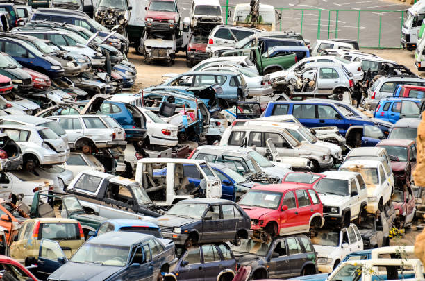 Old Junk Cars On Junkyard Scrap Yard With Pile Of Crushed Cars in tenerife canary islands spain obsolescence stock pictures, royalty-free photos & images