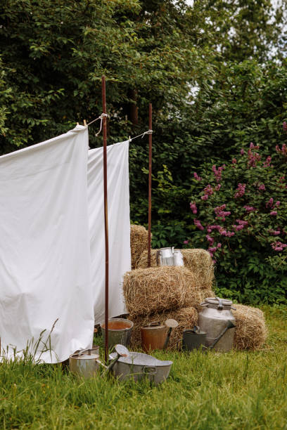 istock Rural summer day with drying ropes and hay. 1682159720