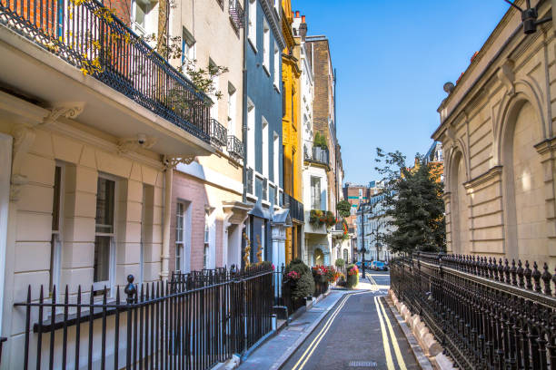 Street view in Mayfair with beautiful periodic buildings. London London, UK - 9 September, 2023: Street view in Mayfair with beautiful periodic buildings. Mayfair is one of the richest areas to live with fancy lifestyle Mayfair stock pictures, royalty-free photos & images