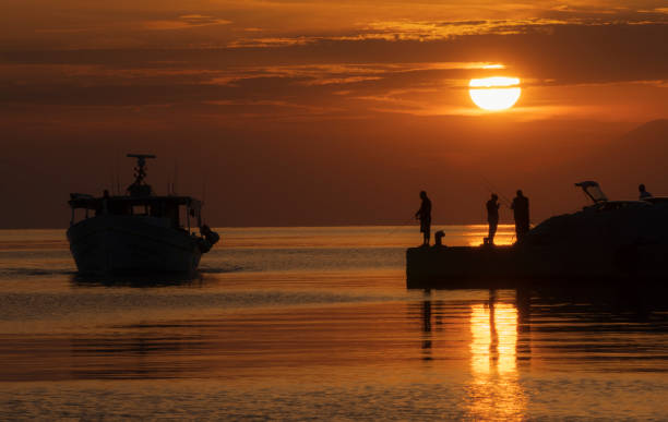 Free Stock Photo of Sunset silhouette on the beach with sailors ...
